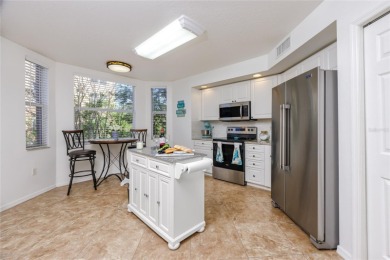 Discover luxury living in this stunning corner condo featuring on East Bay Golf Club in Florida - for sale on GolfHomes.com, golf home, golf lot