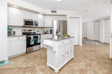 Discover luxury living in this stunning corner condo featuring on East Bay Golf Club in Florida - for sale on GolfHomes.com, golf home, golf lot