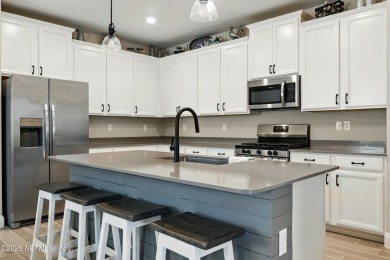 This immaculate home built in 2021 is MOVE IN READY and offers on Golf Club At South Hampton in Florida - for sale on GolfHomes.com, golf home, golf lot