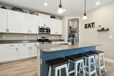 This immaculate home built in 2021 is MOVE IN READY and offers on Golf Club At South Hampton in Florida - for sale on GolfHomes.com, golf home, golf lot