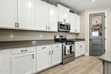 This immaculate home built in 2021 is MOVE IN READY and offers on Golf Club At South Hampton in Florida - for sale on GolfHomes.com, golf home, golf lot