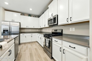 This immaculate home built in 2021 is MOVE IN READY and offers on Golf Club At South Hampton in Florida - for sale on GolfHomes.com, golf home, golf lot