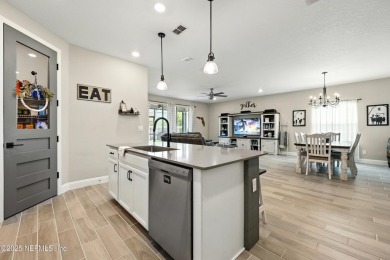 This immaculate home built in 2021 is MOVE IN READY and offers on Golf Club At South Hampton in Florida - for sale on GolfHomes.com, golf home, golf lot