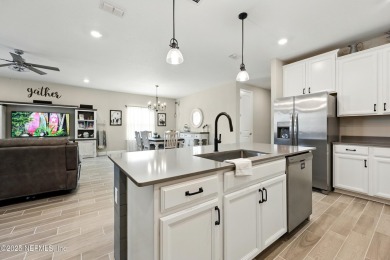 This immaculate home built in 2021 is MOVE IN READY and offers on Golf Club At South Hampton in Florida - for sale on GolfHomes.com, golf home, golf lot