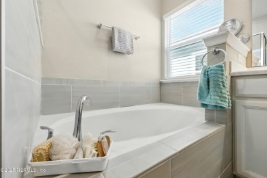 This immaculate home built in 2021 is MOVE IN READY and offers on Golf Club At South Hampton in Florida - for sale on GolfHomes.com, golf home, golf lot