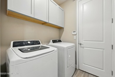 This immaculate home built in 2021 is MOVE IN READY and offers on Golf Club At South Hampton in Florida - for sale on GolfHomes.com, golf home, golf lot
