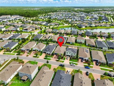 This immaculate home built in 2021 is MOVE IN READY and offers on Golf Club At South Hampton in Florida - for sale on GolfHomes.com, golf home, golf lot