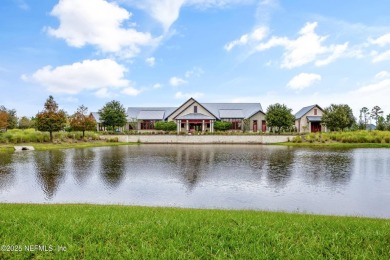 This immaculate home built in 2021 is MOVE IN READY and offers on Golf Club At South Hampton in Florida - for sale on GolfHomes.com, golf home, golf lot