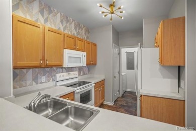 Welcome to this beautifully updated upper-level 2-bedroom on The Captains Club At Woodfield in Michigan - for sale on GolfHomes.com, golf home, golf lot