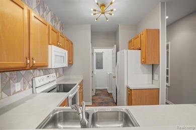 Welcome to this beautifully updated upper-level 2-bedroom on The Captains Club At Woodfield in Michigan - for sale on GolfHomes.com, golf home, golf lot