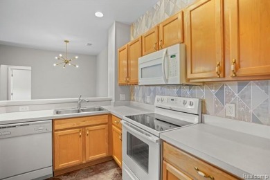 Welcome to this beautifully updated upper-level 2-bedroom on The Captains Club At Woodfield in Michigan - for sale on GolfHomes.com, golf home, golf lot