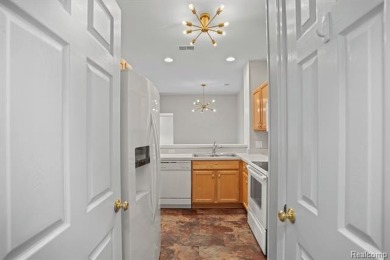 Welcome to this beautifully updated upper-level 2-bedroom on The Captains Club At Woodfield in Michigan - for sale on GolfHomes.com, golf home, golf lot