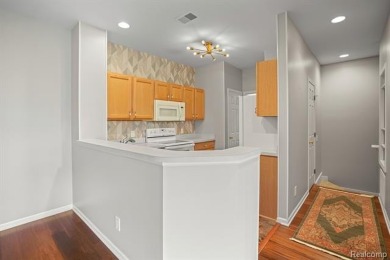 Welcome to this beautifully updated upper-level 2-bedroom on The Captains Club At Woodfield in Michigan - for sale on GolfHomes.com, golf home, golf lot