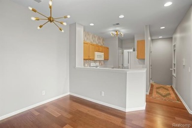 Welcome to this beautifully updated upper-level 2-bedroom on The Captains Club At Woodfield in Michigan - for sale on GolfHomes.com, golf home, golf lot