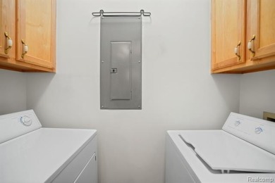 Welcome to this beautifully updated upper-level 2-bedroom on The Captains Club At Woodfield in Michigan - for sale on GolfHomes.com, golf home, golf lot