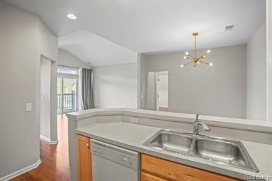 Welcome to this beautifully updated upper-level 2-bedroom on The Captains Club At Woodfield in Michigan - for sale on GolfHomes.com, golf home, golf lot