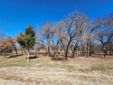 Nice half acre building site lot with mature oak trees to build on Nocona Hills Golf Course in Texas - for sale on GolfHomes.com, golf home, golf lot