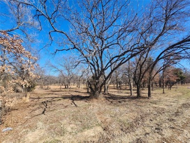 Nice half acre building site lot with mature oak trees to build on Nocona Hills Golf Course in Texas - for sale on GolfHomes.com, golf home, golf lot