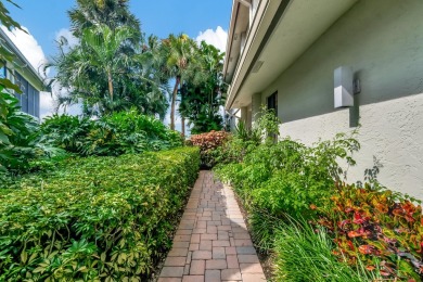 Charter Cay 2nd floor club villa with magnificent water and golf on Boca West Golf and Country Club in Florida - for sale on GolfHomes.com, golf home, golf lot