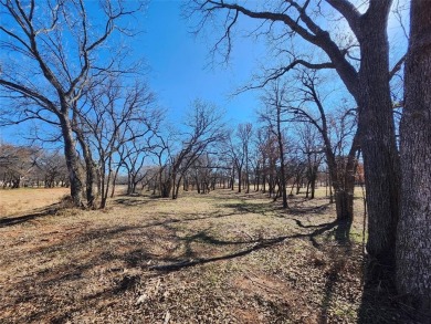 Nice half acre building site lot with mature oak trees to build on Nocona Hills Golf Course in Texas - for sale on GolfHomes.com, golf home, golf lot