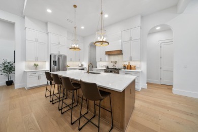 This stunning NEW CONSTRUCTION home Wild Heron is a single level on Sharks Tooth Golf Club in Florida - for sale on GolfHomes.com, golf home, golf lot