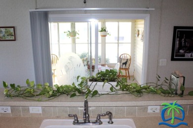 **Charming Waterfront Retreat in Florida!** NEW ROOF 2025! on Cypresswood Golf and Country Club in Florida - for sale on GolfHomes.com, golf home, golf lot