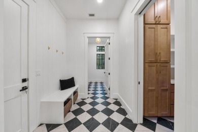 This stunning NEW CONSTRUCTION home Wild Heron is a single level on Sharks Tooth Golf Club in Florida - for sale on GolfHomes.com, golf home, golf lot