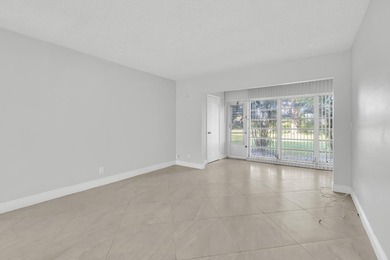 Beautifully updated and spacious 55+ ground-floor condo with no on Villa Del Ray Golf Club in Florida - for sale on GolfHomes.com, golf home, golf lot