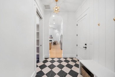 This stunning NEW CONSTRUCTION home Wild Heron is a single level on Sharks Tooth Golf Club in Florida - for sale on GolfHomes.com, golf home, golf lot