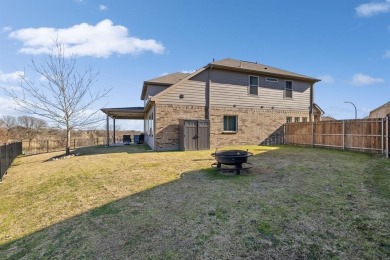 This gorgeous four-bedroom, 2.5-bath, two-story home is in a on The Golf Club At Champions Circle in Texas - for sale on GolfHomes.com, golf home, golf lot