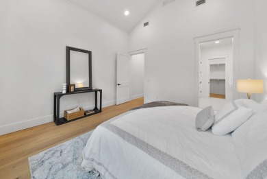 This stunning NEW CONSTRUCTION home Wild Heron is a single level on Sharks Tooth Golf Club in Florida - for sale on GolfHomes.com, golf home, golf lot