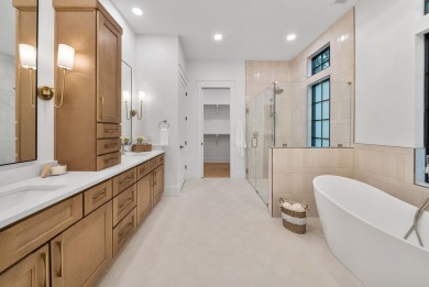 This stunning NEW CONSTRUCTION home Wild Heron is a single level on Sharks Tooth Golf Club in Florida - for sale on GolfHomes.com, golf home, golf lot
