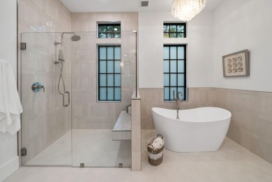 This stunning NEW CONSTRUCTION home Wild Heron is a single level on Sharks Tooth Golf Club in Florida - for sale on GolfHomes.com, golf home, golf lot
