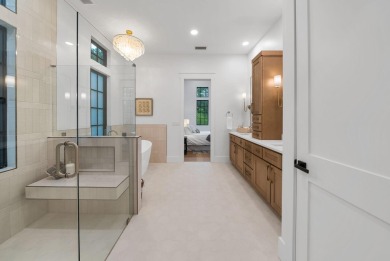 This stunning NEW CONSTRUCTION home Wild Heron is a single level on Sharks Tooth Golf Club in Florida - for sale on GolfHomes.com, golf home, golf lot