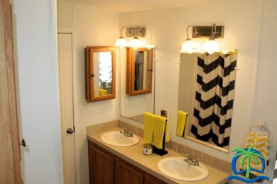 **Charming Waterfront Retreat in Florida!** NEW ROOF 2025! on Cypresswood Golf and Country Club in Florida - for sale on GolfHomes.com, golf home, golf lot