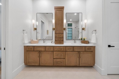 This stunning NEW CONSTRUCTION home Wild Heron is a single level on Sharks Tooth Golf Club in Florida - for sale on GolfHomes.com, golf home, golf lot