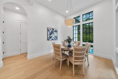This stunning NEW CONSTRUCTION home Wild Heron is a single level on Sharks Tooth Golf Club in Florida - for sale on GolfHomes.com, golf home, golf lot