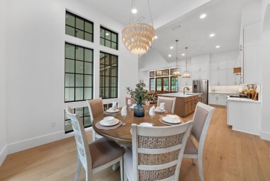 This stunning NEW CONSTRUCTION home Wild Heron is a single level on Sharks Tooth Golf Club in Florida - for sale on GolfHomes.com, golf home, golf lot