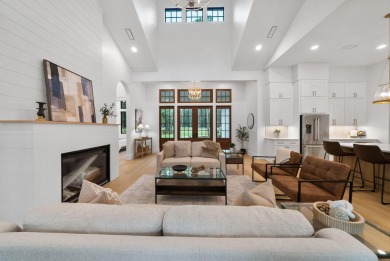 This stunning NEW CONSTRUCTION home Wild Heron is a single level on Sharks Tooth Golf Club in Florida - for sale on GolfHomes.com, golf home, golf lot