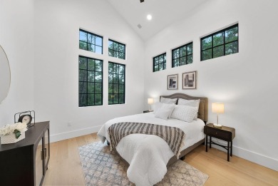 This stunning NEW CONSTRUCTION home Wild Heron is a single level on Sharks Tooth Golf Club in Florida - for sale on GolfHomes.com, golf home, golf lot