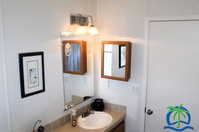 **Charming Waterfront Retreat in Florida!** NEW ROOF 2025! on Cypresswood Golf and Country Club in Florida - for sale on GolfHomes.com, golf home, golf lot