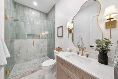 This stunning NEW CONSTRUCTION home Wild Heron is a single level on Sharks Tooth Golf Club in Florida - for sale on GolfHomes.com, golf home, golf lot