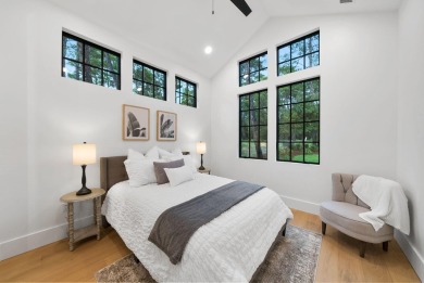 This stunning NEW CONSTRUCTION home Wild Heron is a single level on Sharks Tooth Golf Club in Florida - for sale on GolfHomes.com, golf home, golf lot