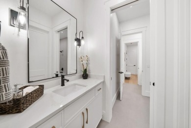 This stunning NEW CONSTRUCTION home Wild Heron is a single level on Sharks Tooth Golf Club in Florida - for sale on GolfHomes.com, golf home, golf lot