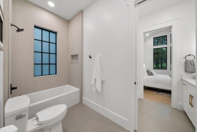 This stunning NEW CONSTRUCTION home Wild Heron is a single level on Sharks Tooth Golf Club in Florida - for sale on GolfHomes.com, golf home, golf lot