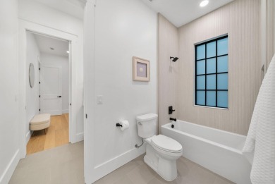 This stunning NEW CONSTRUCTION home Wild Heron is a single level on Sharks Tooth Golf Club in Florida - for sale on GolfHomes.com, golf home, golf lot