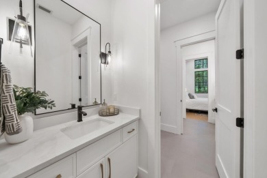 This stunning NEW CONSTRUCTION home Wild Heron is a single level on Sharks Tooth Golf Club in Florida - for sale on GolfHomes.com, golf home, golf lot