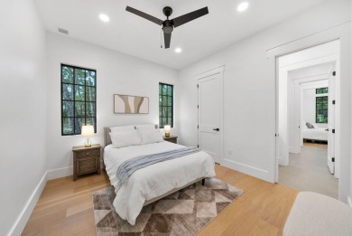 This stunning NEW CONSTRUCTION home Wild Heron is a single level on Sharks Tooth Golf Club in Florida - for sale on GolfHomes.com, golf home, golf lot
