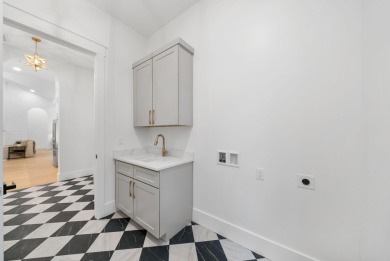 This stunning NEW CONSTRUCTION home Wild Heron is a single level on Sharks Tooth Golf Club in Florida - for sale on GolfHomes.com, golf home, golf lot