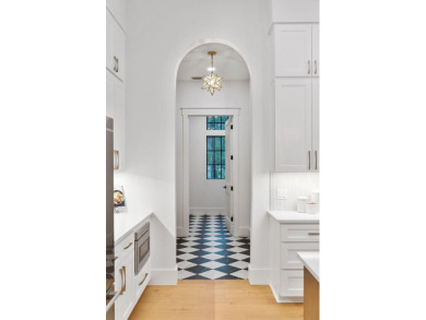This stunning NEW CONSTRUCTION home Wild Heron is a single level on Sharks Tooth Golf Club in Florida - for sale on GolfHomes.com, golf home, golf lot
